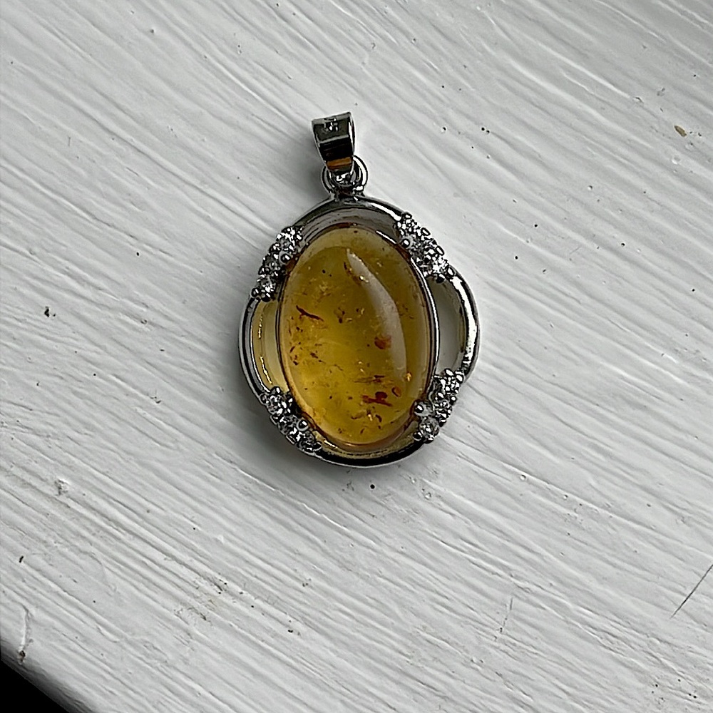 Gold and Silver Necklace with Ornate Gemstone Pendant